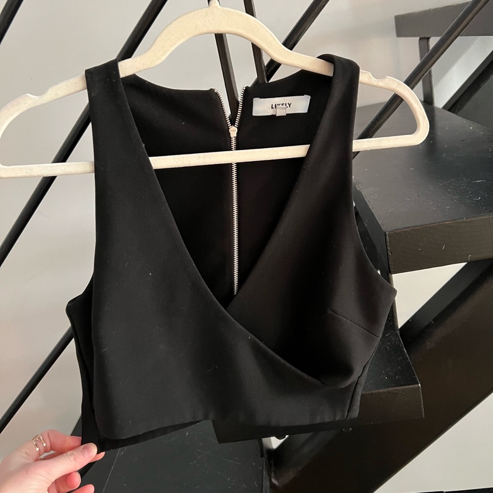 Cross front likely cropped top